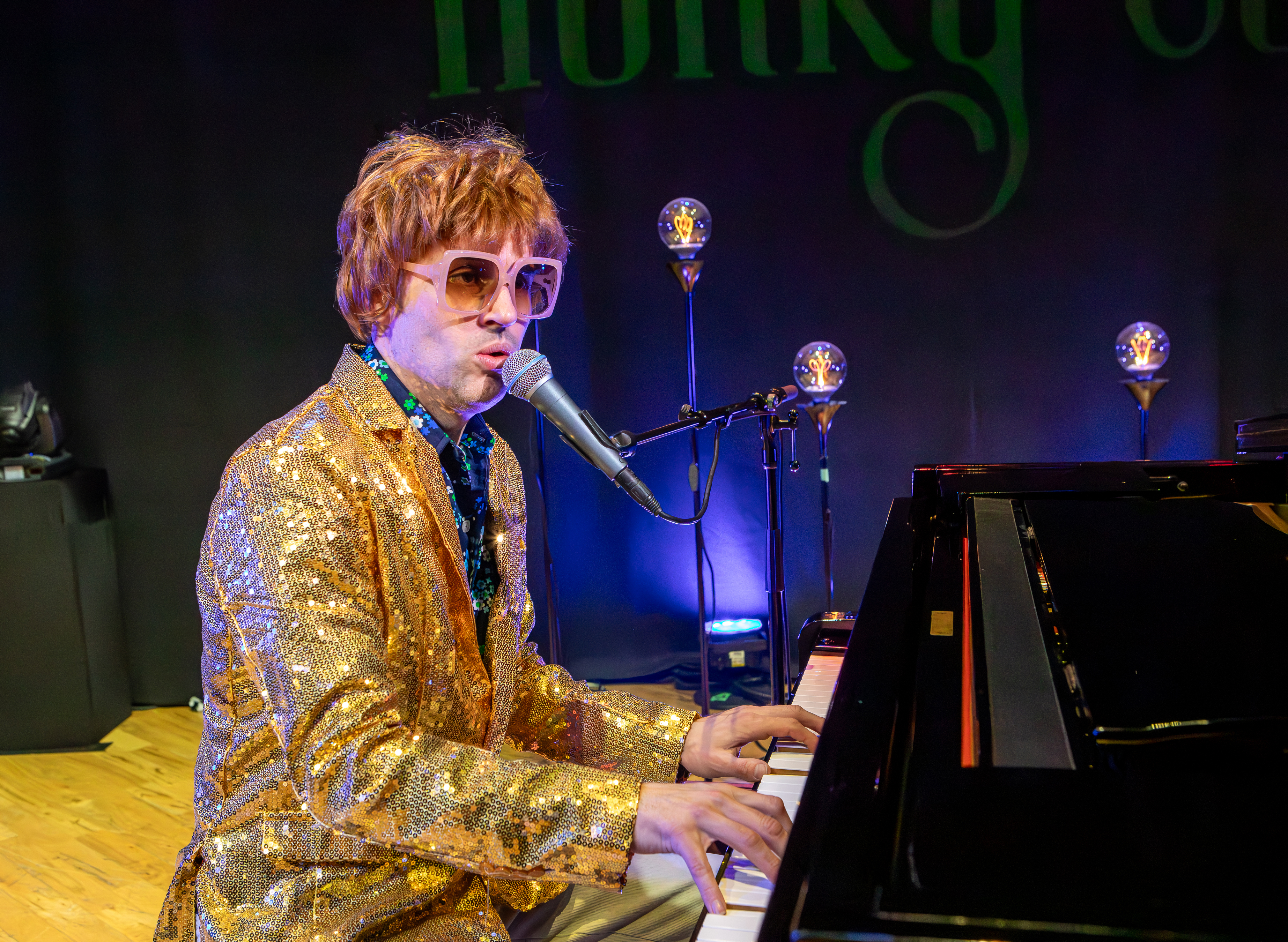 Michael Turner performing Elton John classics on piano at a Vancouver venue